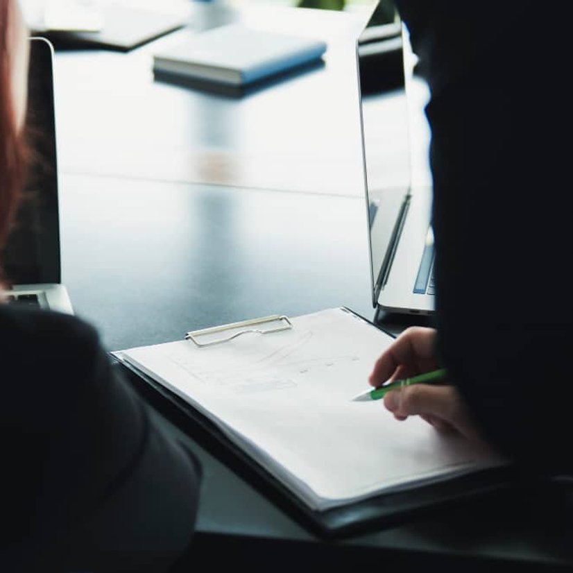 Investigator reviewing case documents in Orange County CA