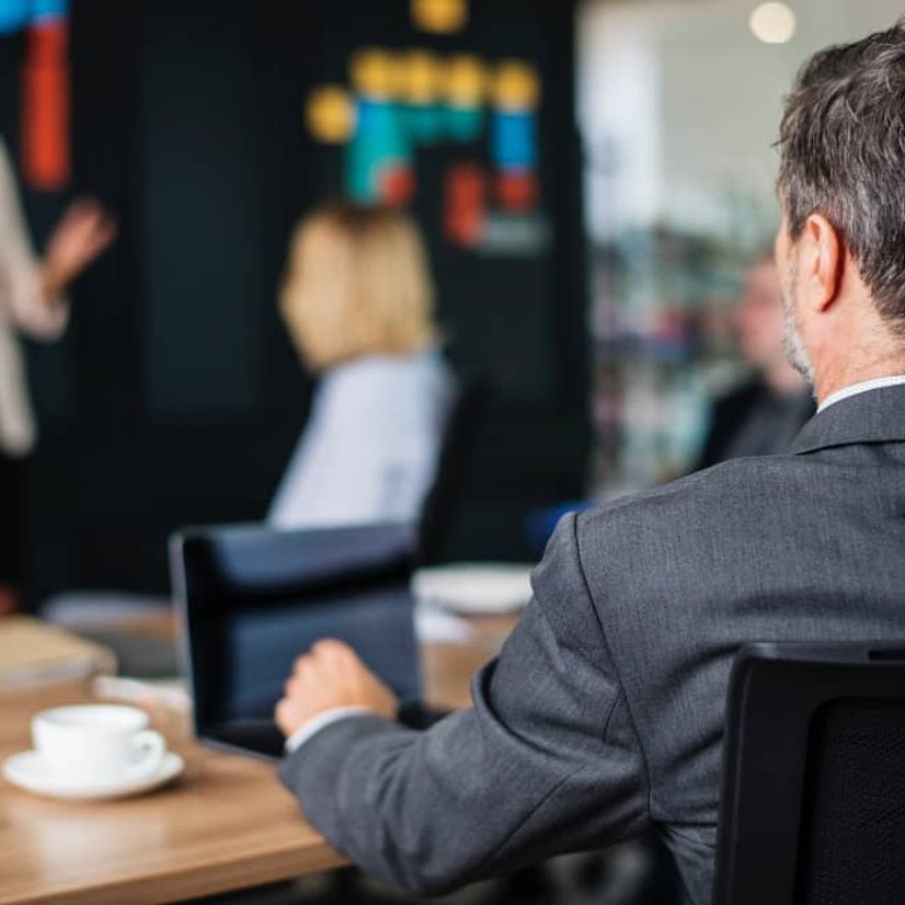 Private investigator taking notes during meeting in Orange County CA